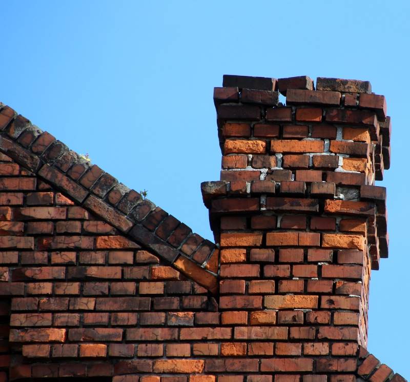 Signs Your Mangonia Park Home Needs a Chimney Inspection Damaged chimney on an Mangonia Park home showing cracks and missing mortar